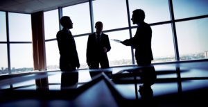 Shady Business Deal made in dark boardroom meeting