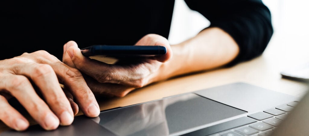 Man using social media application on smartphone for video, live