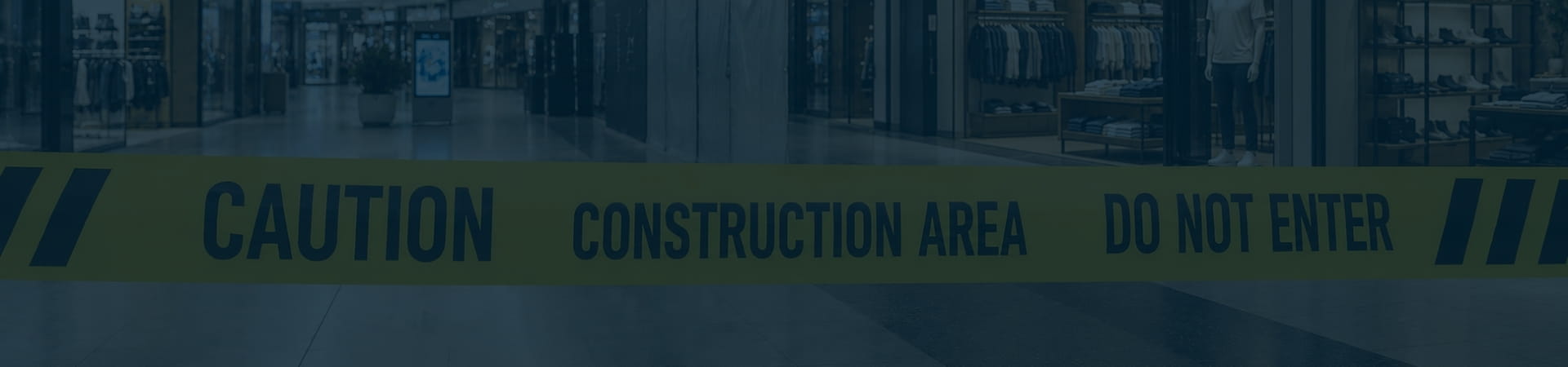 Moreno Valley Mall interior closed off with caution tape reading Construction Area Do Not Enter