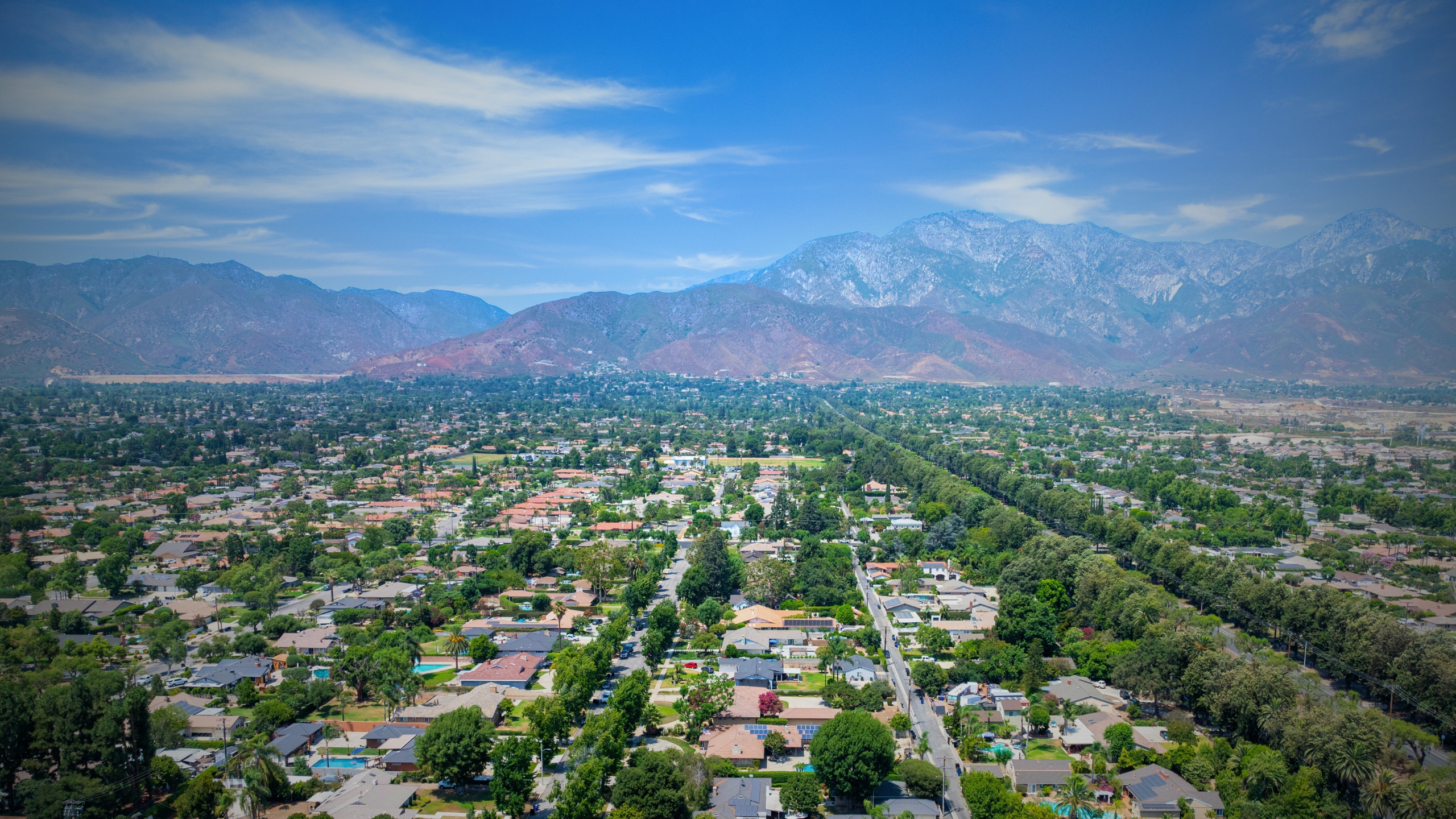 The San Bernardino County Mountains seen from a distance with neighborhoods visible below.