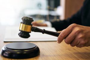 Judge banging gavel in court